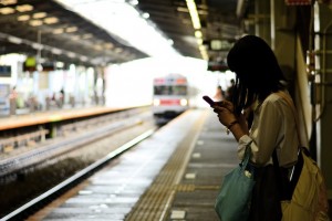 Girl Waiting for Train Tokyo Cell Phone