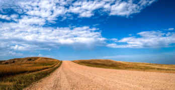 Confessions of a Serial Writer - gravel road and blue sky