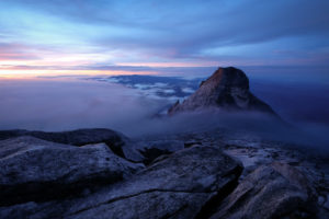 Pandemic Journal - photo of Mt. Kinabalu above misty clouds