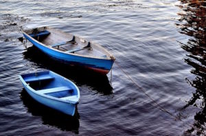 two-blue-boats-on-river