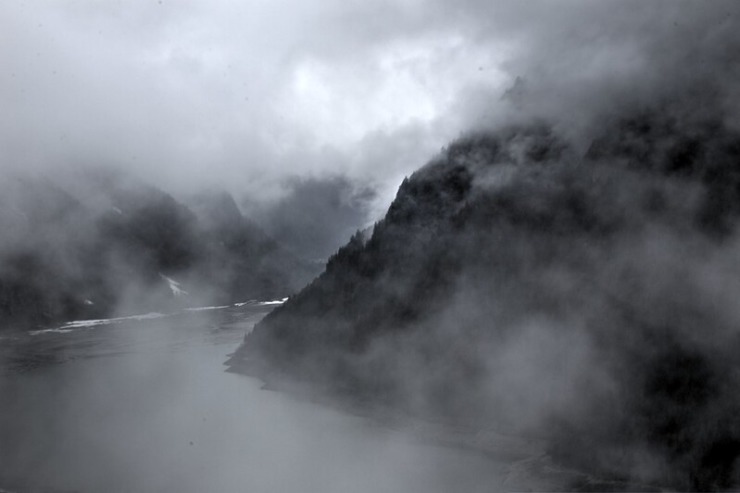black and white river in fog