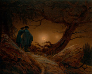 two men in the woods look to the moon whose light gives a warm glow