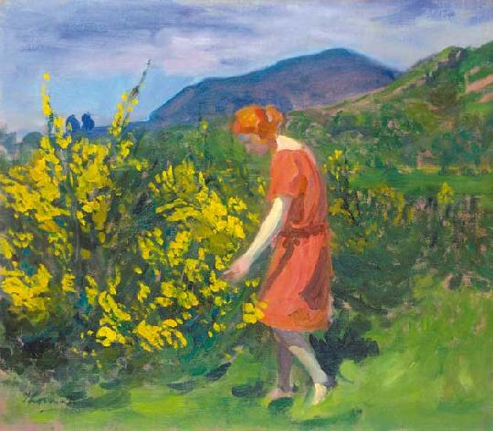 woman leans to pick yellow flowers from a bush