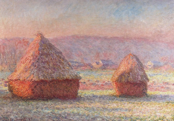 sunrise in french countryside with piles of hay