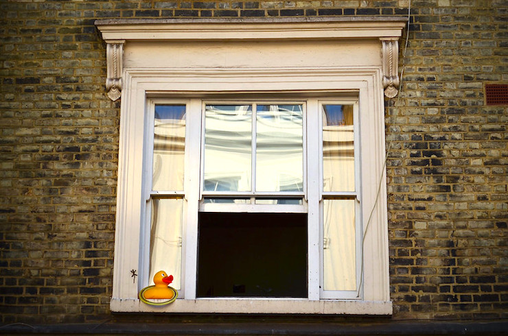 rubber duck on window sill