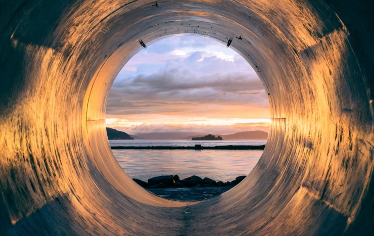 body of water seen through pipe by the sea to illustrate essay plot without conflict