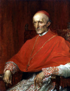 old catholic priest dressed in red