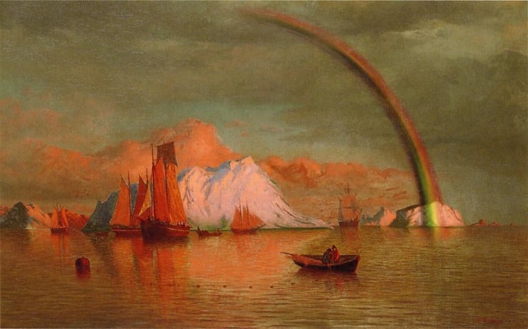 the sun sets over an arctic sea with icebergs floating and the water and sailboat turn into a red glow. a rainbow can be seen in the distance
