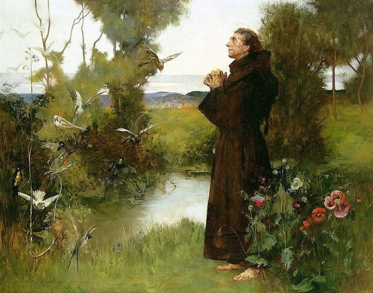 a priest stands outside with his hands clasped in prayer looking at nature 