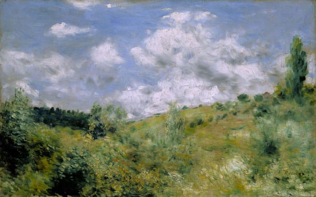 field and the sky with clouds