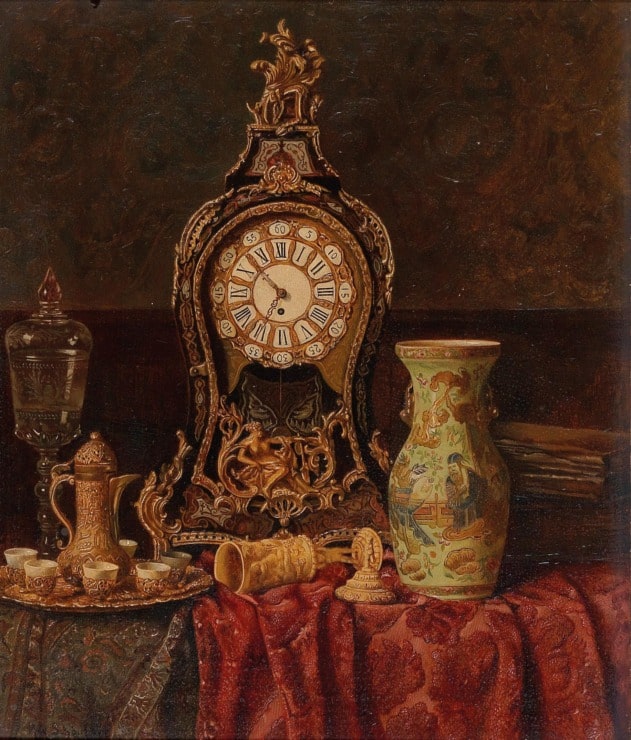 table with various antiques including an old clock