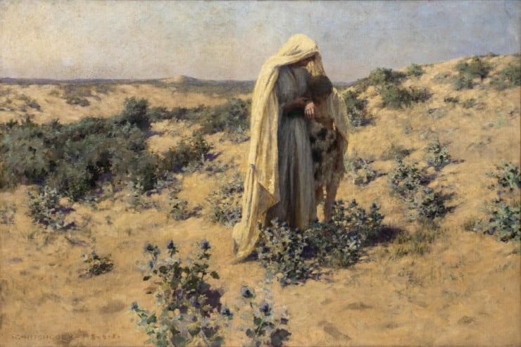 a woman and a young boy in the desert