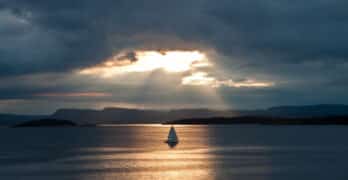 sailboat in water and sunlight