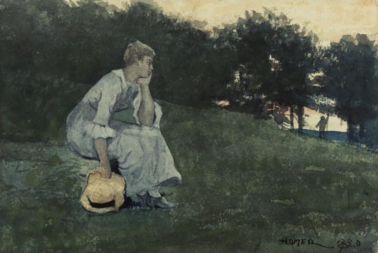 woman slumps on a hillside resting her hand on her chin and hat in hand