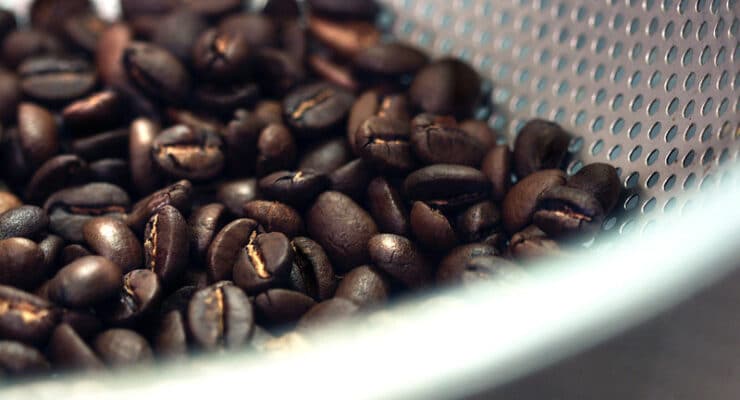 coffee beans in strainer