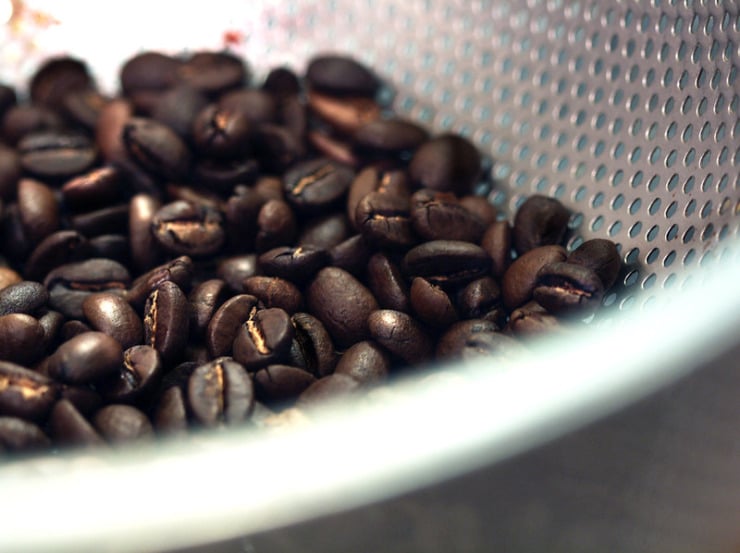 coffee beans in strainer